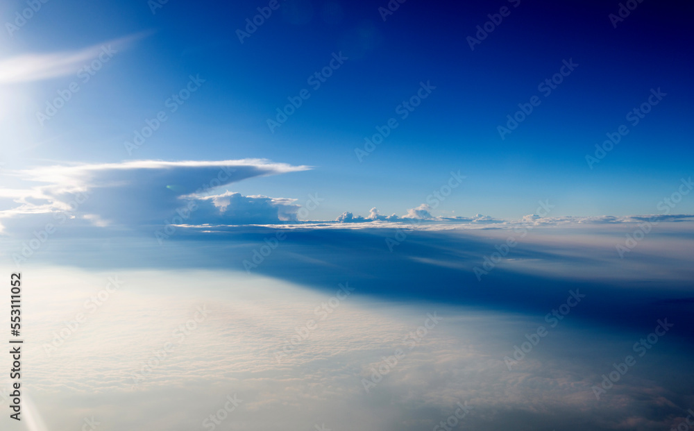 Blue sky and white cloud from airplane window Blue sky and white cloud from airplane window