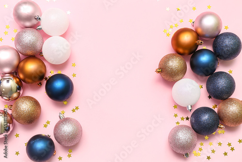 Composition with different Christmas balls on pink background