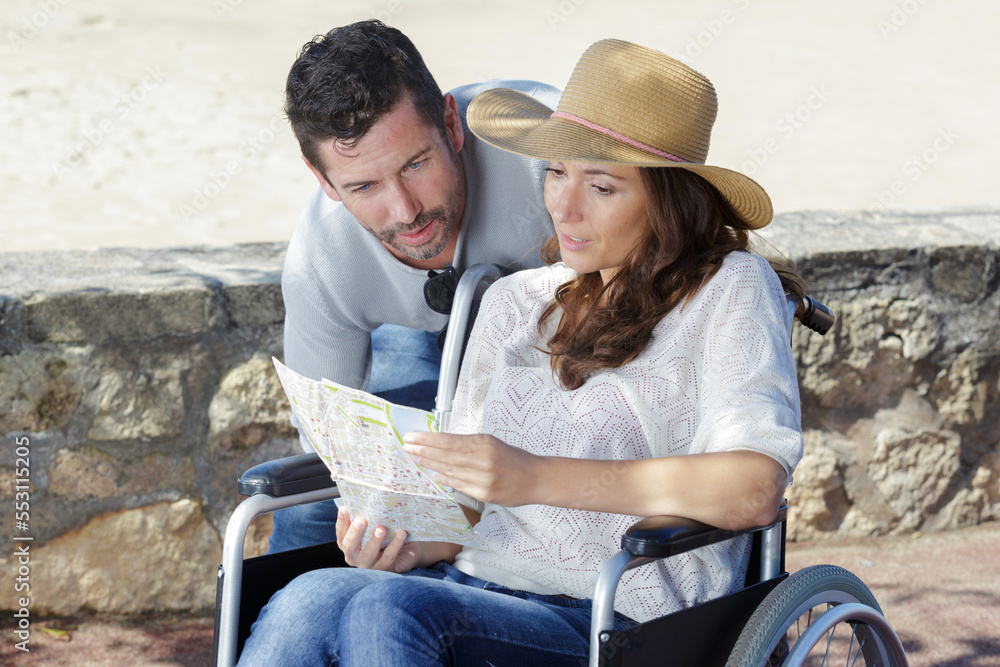 handicapped woman in wheelchair and boyfriend on holidays