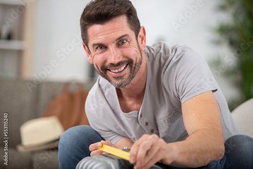 man checking hand luggage size