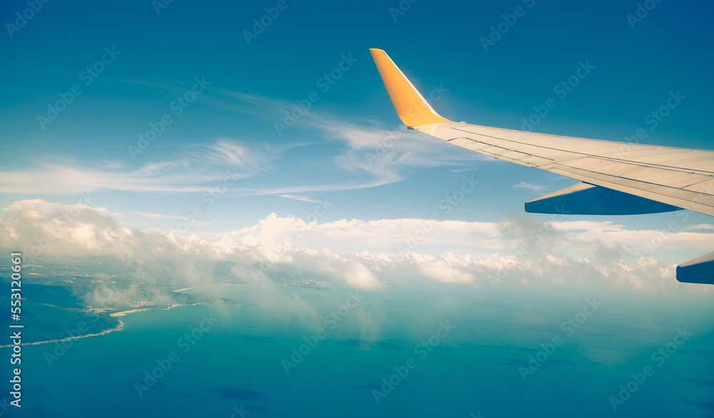 Fototapeta premium Morning sunrise with Wing of an airplane. Photo applied to tourism operators. picture for add text message or frame website. Traveling concept