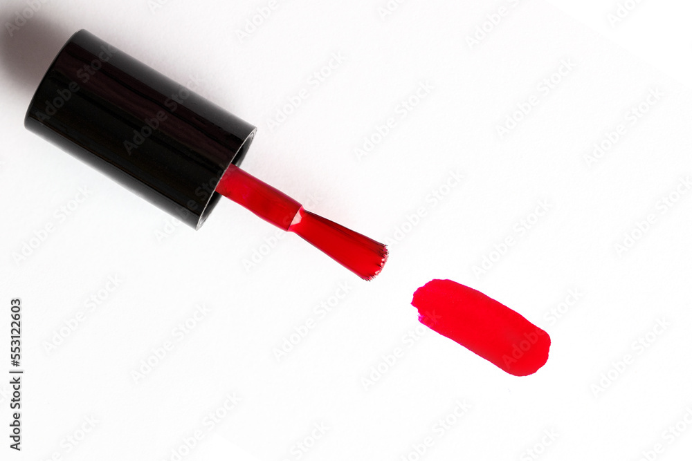 Brush with nail polish and blot on white background Brush with nail polish and blot on white background