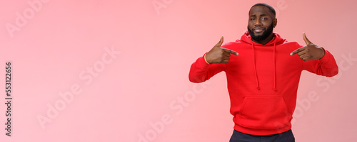 Proud cheeky confident young bearded african american man pointing himself bragging charish praise himself standing spotlight liking be center attention, smirking gladly, pink background