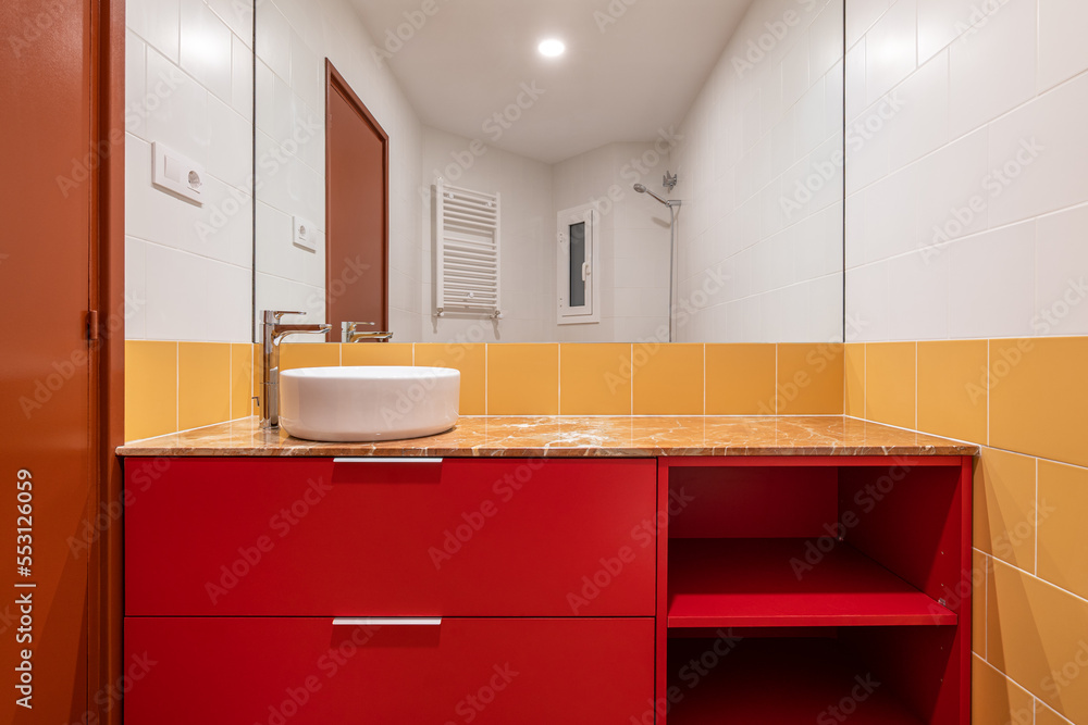 Foto de Overhead white sink on a red in a bright white and yellow bathroom White and