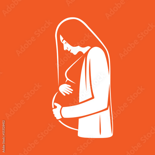 Pregnant woman hugging her unborn child.