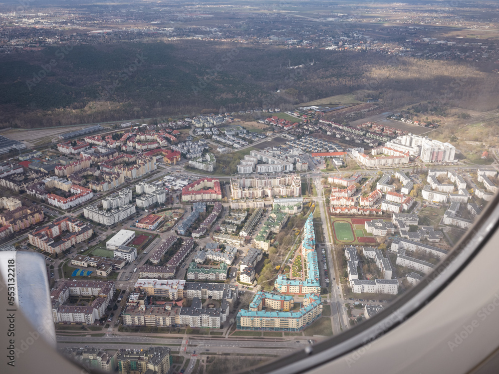 cityscape of warsaw seen from airplane window side seat