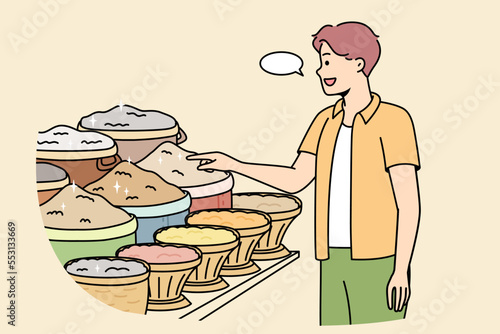 Man at grocery market asks price of condiments. Male buyer chooses ingredients for lunch. Guy wants to buy grits, cereals for home cooking. Food shopping. Vector linear colored illustration.