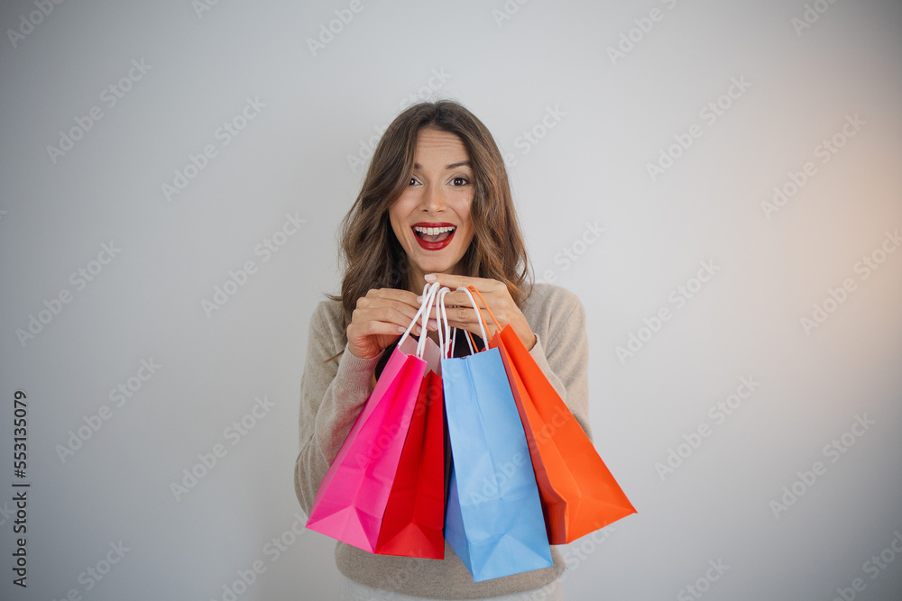 Happy woman with shopping bags shopaholic