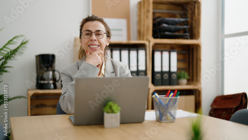 Middle age hispanic woman business worker using laptop at office © Krakenimages.com