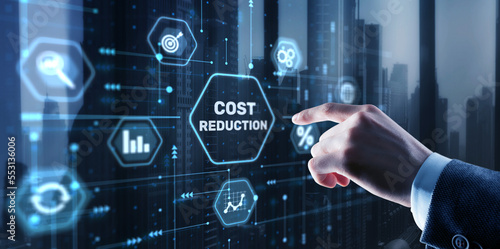 Cost reduction business finance concept. Businessman clicks virtual screen photo