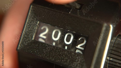 Number on a tally counter changing from 1999 to 2030 photo