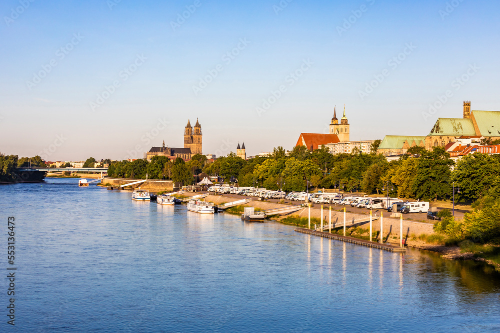 Germany, Saxony-Anhalt, Magdeburg, Motor homes parked in front of marina on Elbe river Germany, Saxony-Anhalt, Magdeburg, Motor homes parked in front of marina on Elbe river
