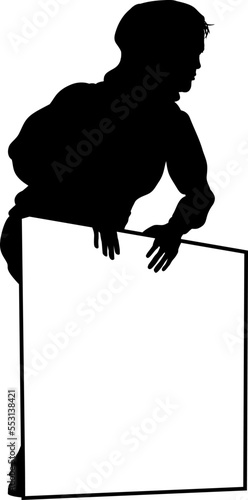 Protestor or demonstrator at a demonstration march, picket line or strike protest rally in silhouette. Holding up a banner or picket sign board placard.