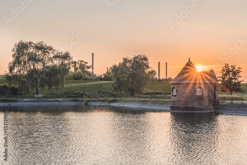 Germany, Hamburg, Historic filter house on Kaltehofe island at sunset photo