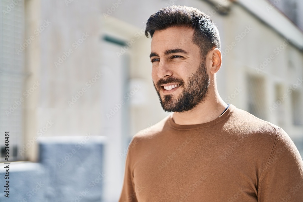 Young hispanic man smiling confident standing at street Young hispanic man smiling confident standing at street