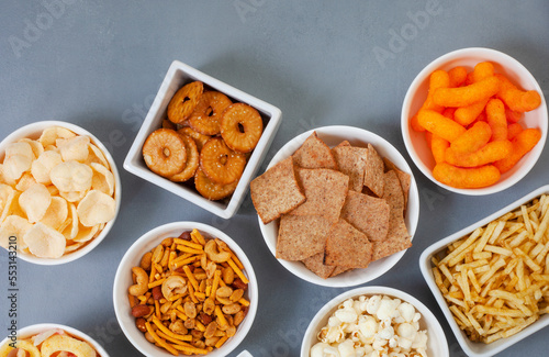 Party snacks, an assortment on gray with copy space