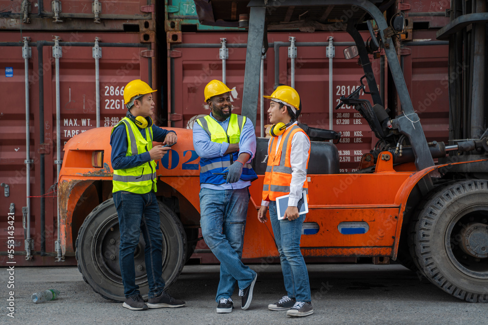 Engineer working and checking a quality of containers box from cargo ship for export and import,Container Shipping Logistics Engineering concept. Engineer working and checking a quality of containers box from cargo ship for export and import,Container Shipping Logistics Engineering concept.