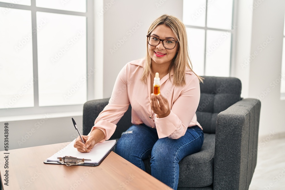 Young hispanic woman having psychology session prescribe pills psychology center Young hispanic woman having psychology session prescribe pills psychology center