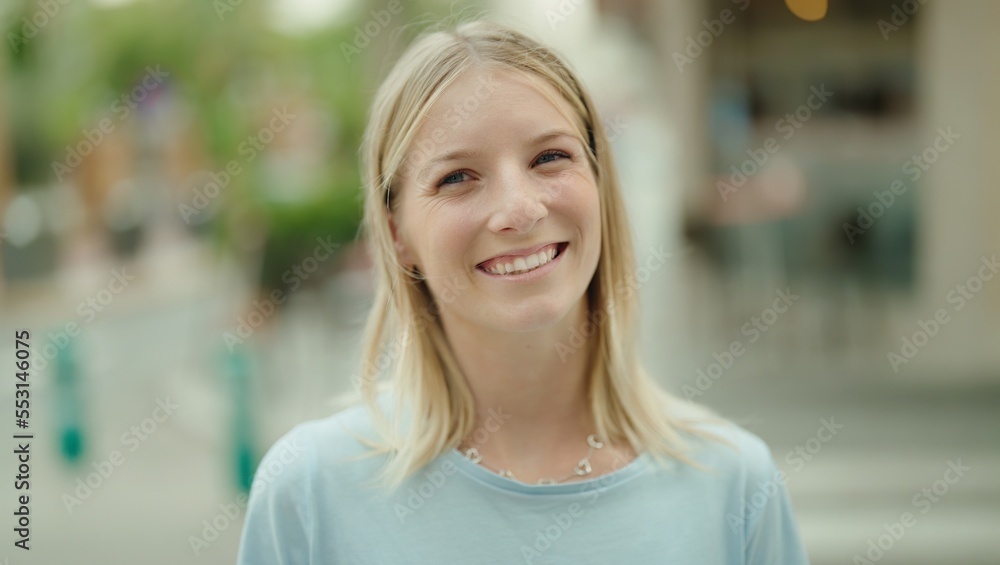 Young blonde woman smiling confident standing at street Young blonde woman smiling confident standing at street
