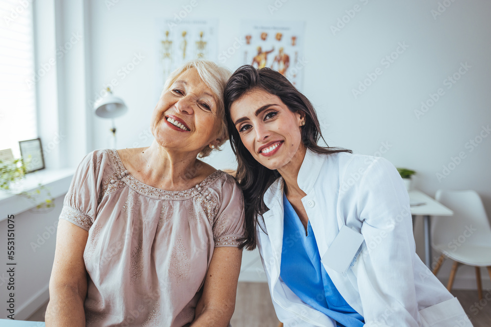 Fototapeta premium The elderly woman enjoys an embrace from her favorite home healthcare nurse. Medical care, young female doctor hugging patient. Empathy concept. Elderly woman hugging caregiver