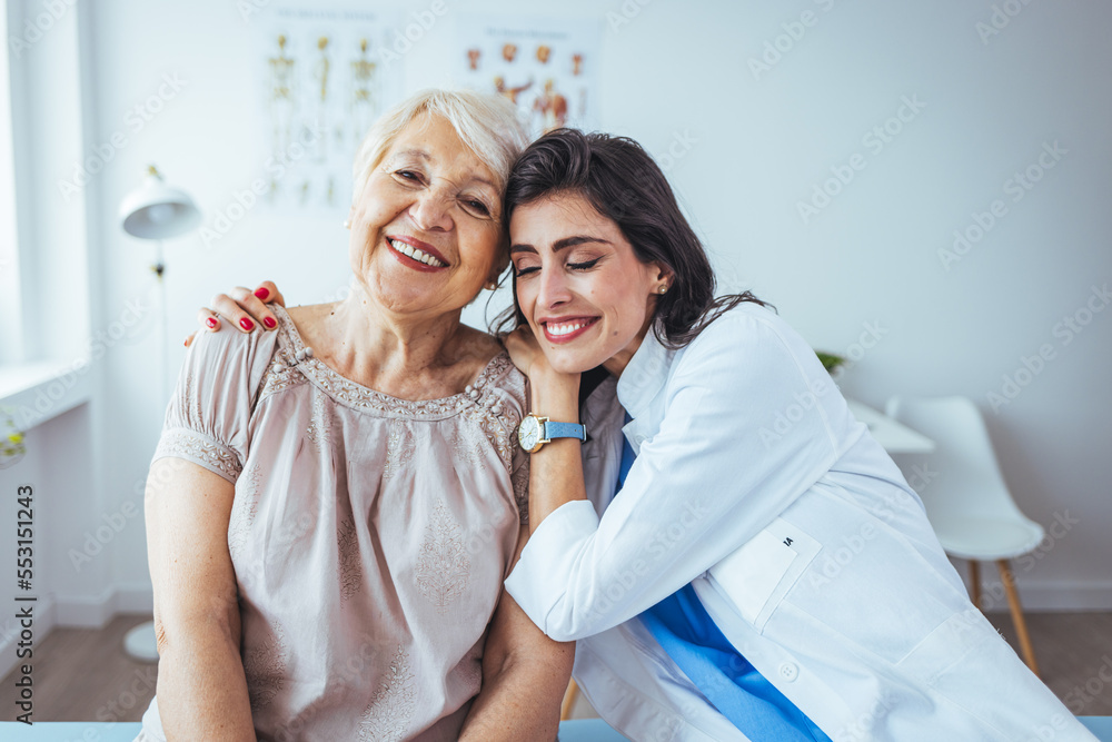The elderly woman enjoys an embrace from her favorite home healthcare nurse. Medical care, young female doctor hugging patient. Empathy concept. Elderly woman hugging caregiver The elderly woman enjoys an embrace from her favorite home healthcare nurse. Medical care, young female doctor hugging patient. Empathy concept. Elderly woman hugging caregiver