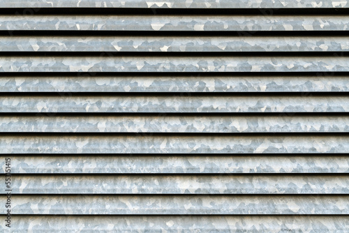 Large zinc metal plated ventilation grille on the wall