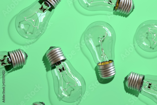 Close-up of an incandescent lamp on green background.