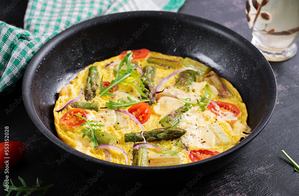 Healthy asparagus omelette. Eggs omelet with asparagus, tomatoes, and cheese. Healthy asparagus omelette. Eggs omelet with asparagus, tomatoes, and cheese.