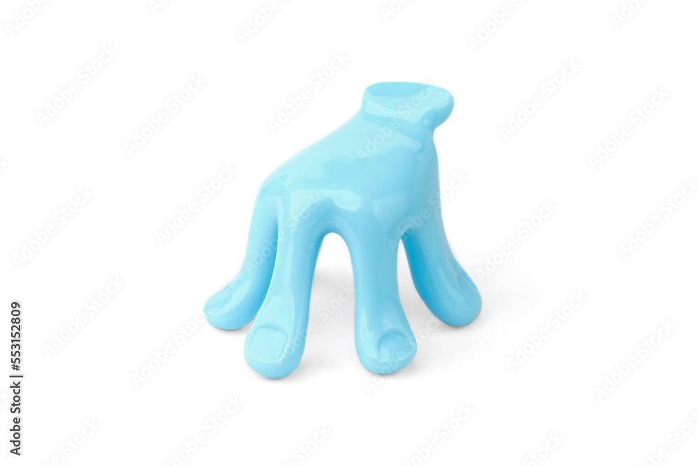Blue plastic massage tool in hand shape isolated on white background. Blue plastic massage tool in hand shape isolated on white background.