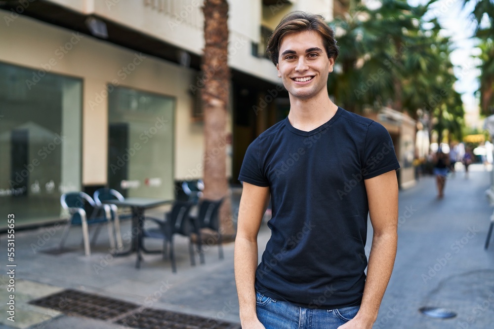Young caucasian man smiling confident standing at coffee shop terrace Young caucasian man smiling confident standing at coffee shop terrace