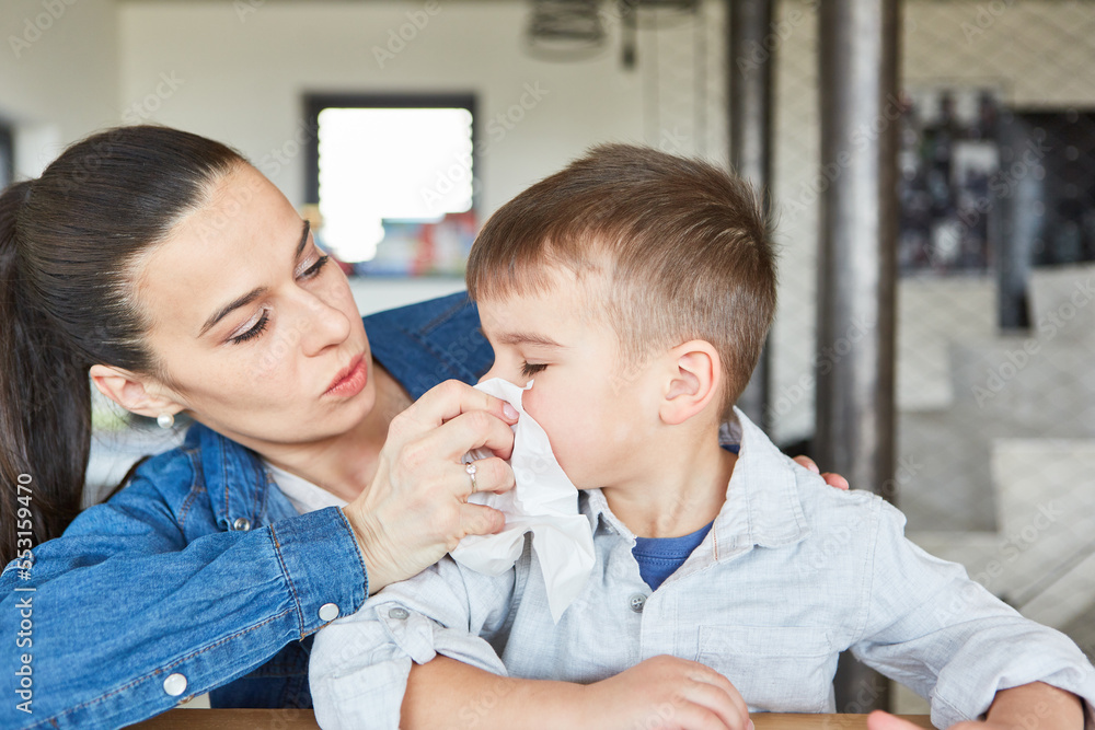 Caring mother blows her son's nose Stock Photo | Adobe Stock