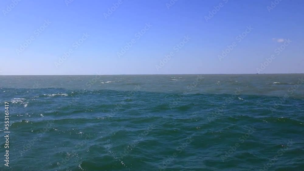 Hydrofront is the border between river and sea waters. Depending on the direction of the wind, the border is clear or blurred. Hydrofront is the border between river and sea waters. Depending on the direction of the wind, the border is clear or blurred.