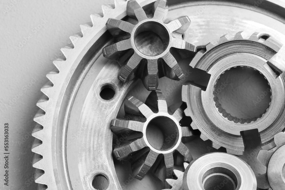 Different stainless steel gears on light grey background, top view Different stainless steel gears on light grey background, top view