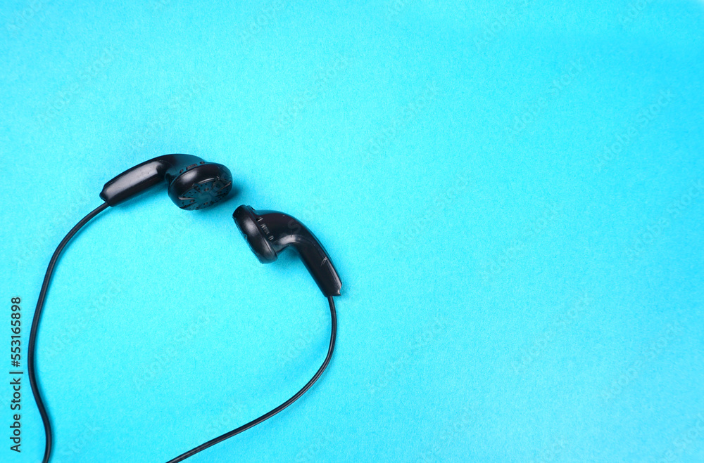 Top view of Mobile phone with headphones isolated on colorful background, Listen to music. Space for text Top view of Mobile phone with headphones isolated on colorful background, Listen to music. Space for text