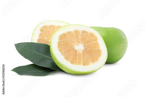 Whole and cut sweetie fruits with green leaves on white background photo