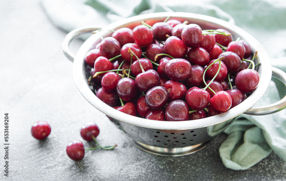 Fresh red cherries fruit in collander Fresh red cherries fruit in collander