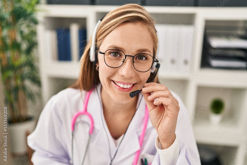Young blonde woman doctor having telemedicine at clinic