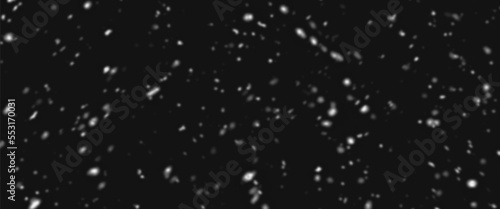 Snowfall bokeh on dark foundation. Numerous snowflakes in flying in the air. Winte night snowfall and snowstorm of snow at. Obscure bokeh light impact innovative foundation.