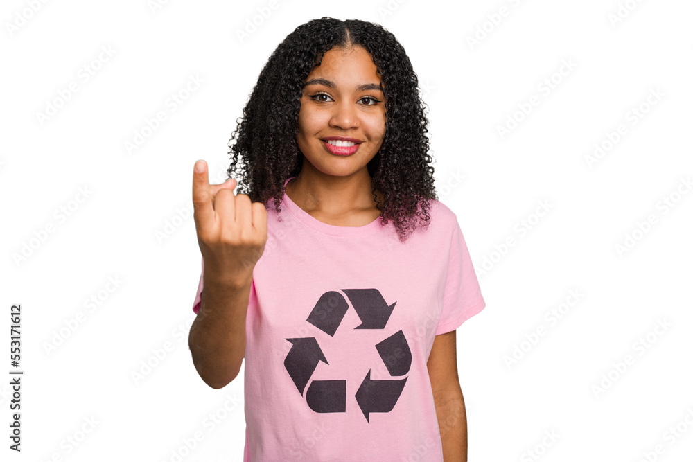 Young african american woman wearing a recycle t-shirt cutout isolated pointing with finger at you as if inviting come closer. Young african american woman wearing a recycle t-shirt cutout isolated pointing with finger at you as if inviting come closer.