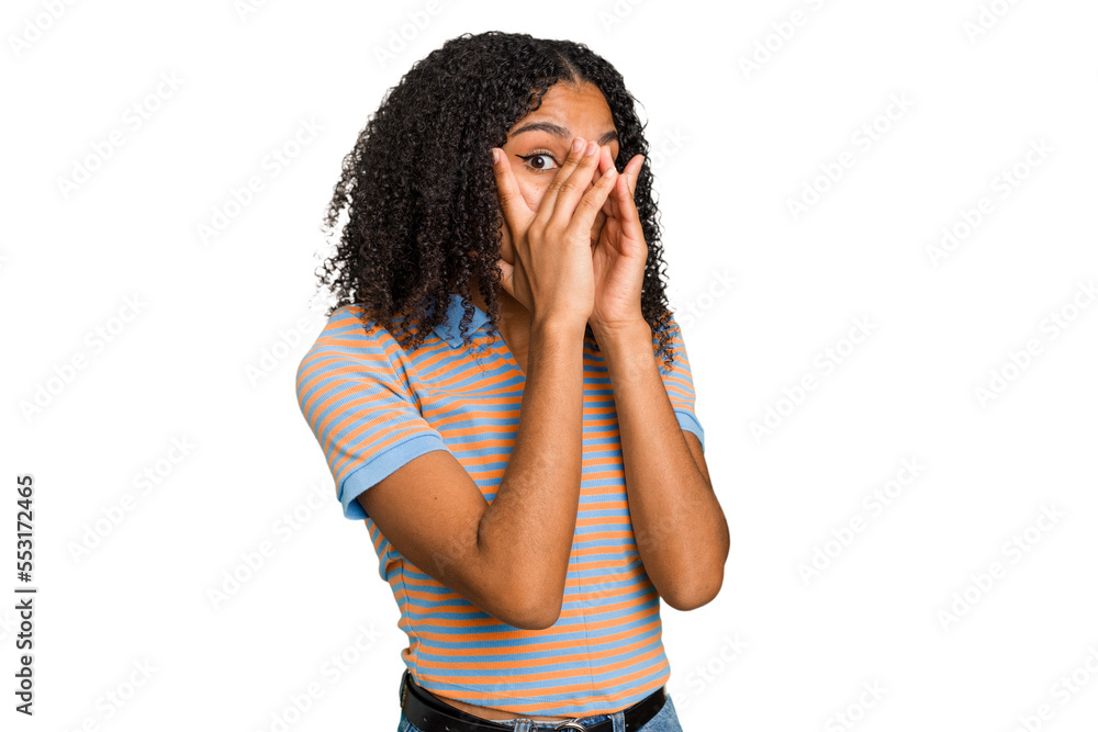 Young african american woman with curly hair cut out isolated blink through fingers frightened and nervous. Young african american woman with curly hair cut out isolated blink through fingers frightened and nervous.