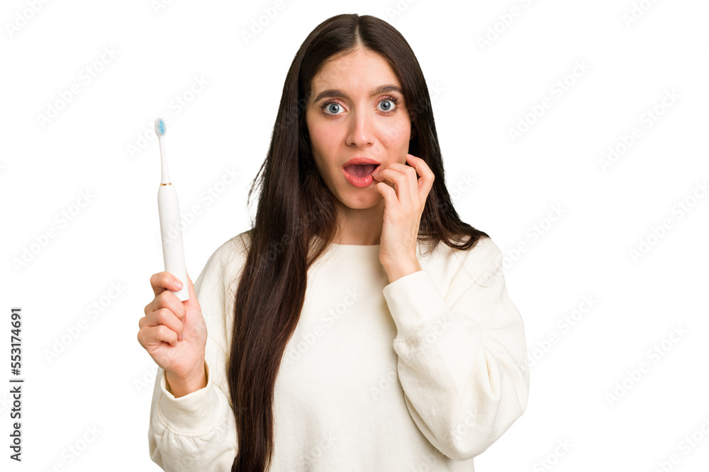 Young caucasian holding a brushing teeth isolated biting fingernails, nervous and very anxious. Young caucasian holding a brushing teeth isolated biting fingernails, nervous and very anxious.