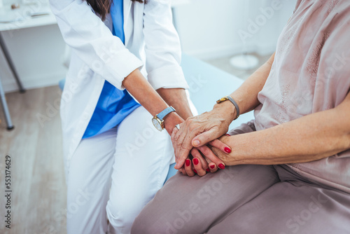 Closeup shot of an unrecognizable female doctor holding a patient's hand in comfort during a consultation inside her office Closeup shot of an unrecognizable doctor holding a patient's hand in comfort