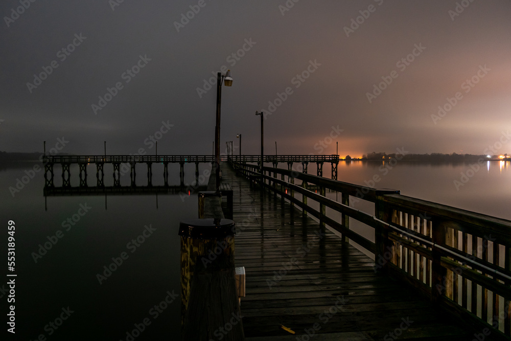 Solomons Island, Maryland, USA A pier on Patuxent river at night looking towards the Chesapeake Bay.