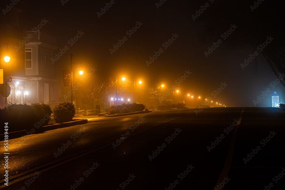 Solomons Island, Maryland, USA A foggy night on the main street. Solomons Island, Maryland, USA A foggy night on the main street.