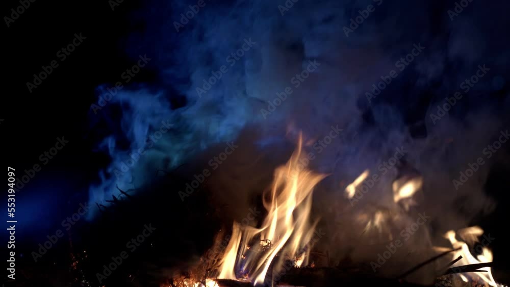 Fire bonfire. Close-up shot of the flames burning in the garden. White smoke from burning leaves makes bio-compost.4K Fire bonfire. Close-up shot of the flames burning in the garden. White smoke from burning leaves makes bio-compost.4K