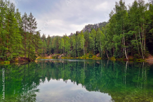 Fototapeta Naklejka Na Ścianę i Meble -  Beautiful picturesque forest lake in a mountainous area.
