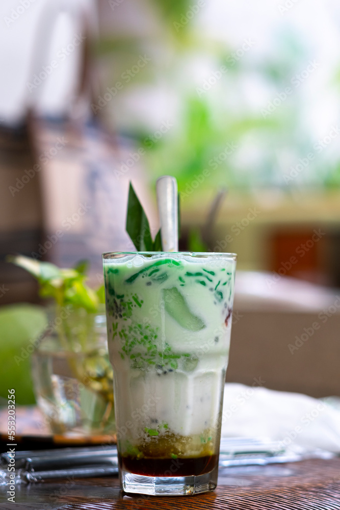 Es cendol is a traditional Indonesian iced dessert. Popular during fasting in Ramadan. A refreshing cold drink when drunk in the day and evening. Vertical image orientation. Es cendol is a traditional Indonesian iced dessert. Popular during fasting in Ramadan. A refreshing cold drink when drunk in the day and evening. Vertical image orientation.