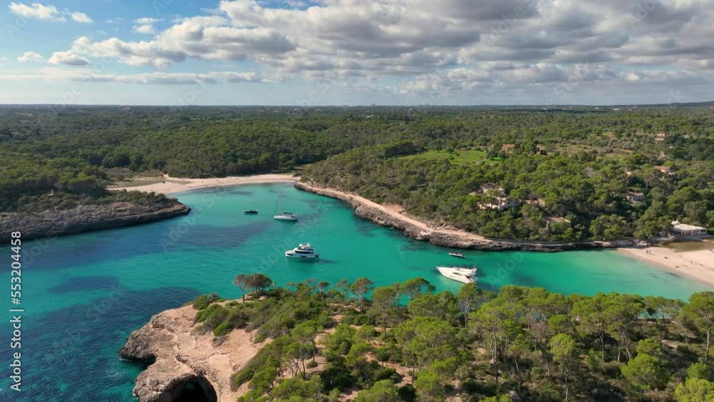 aerial view of yachts anchoring in a bay in Mallorca with clear turquoise water. Mediterranean Sea. Beach in Majorca aerial view of yachts anchoring in a bay in Mallorca with clear turquoise water. Mediterranean Sea. Beach in Majorca