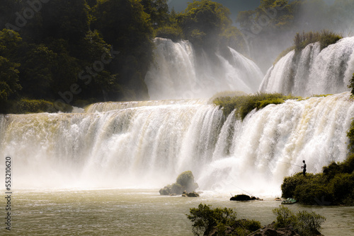 Gorgeous Detian Falls in Guangxi  China and Banyue Falls in Vietnam with fisherman 