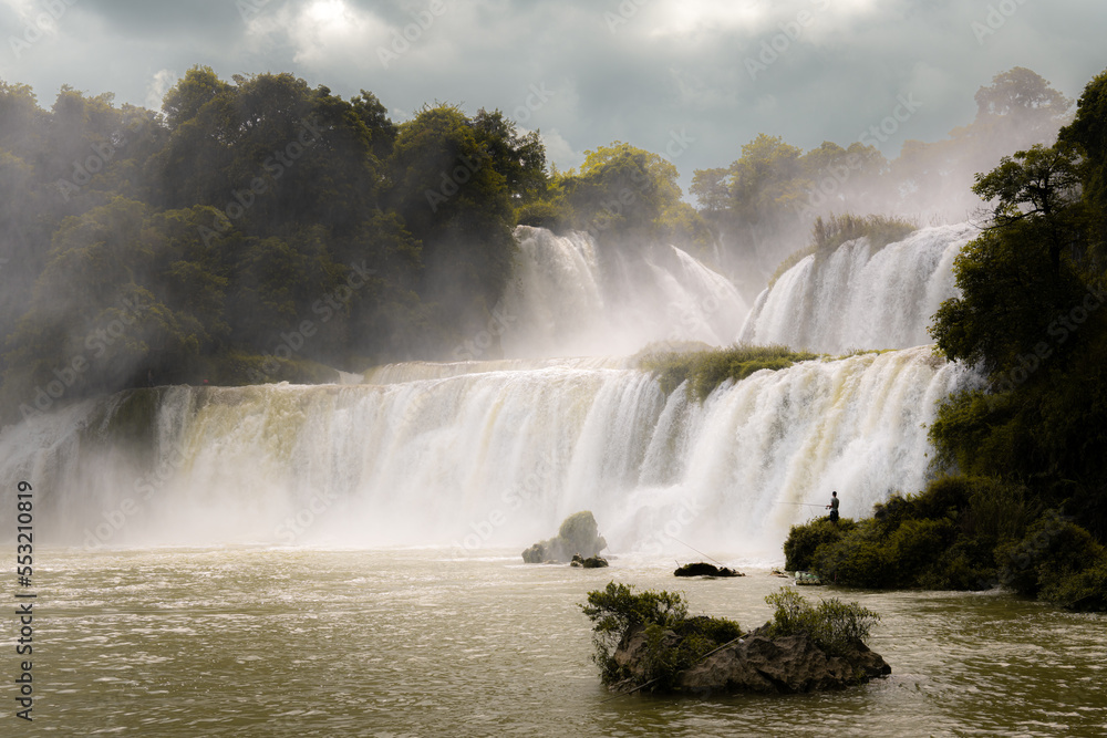 Dramatic sky panorama of Detian falls, Guangxi province, China, is the largest transnational waterfall in Asia, copy space for text Dramatic sky panorama of Detian falls, Guangxi province, China, is the largest transnational waterfall in Asia, copy space for text
